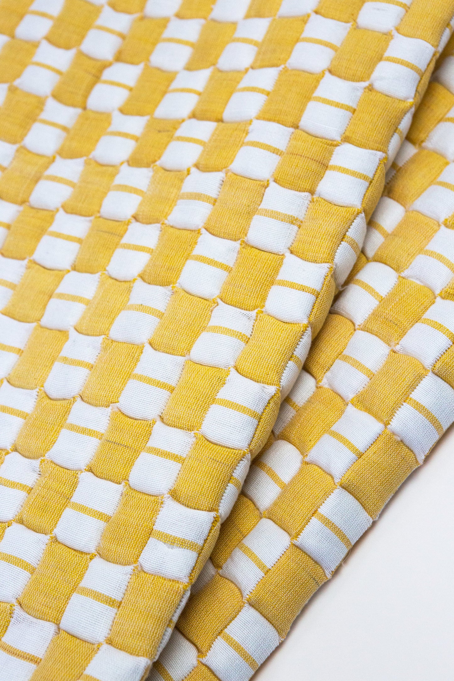 Geocheck Bauhaus Quilted Blanket in Trumpet