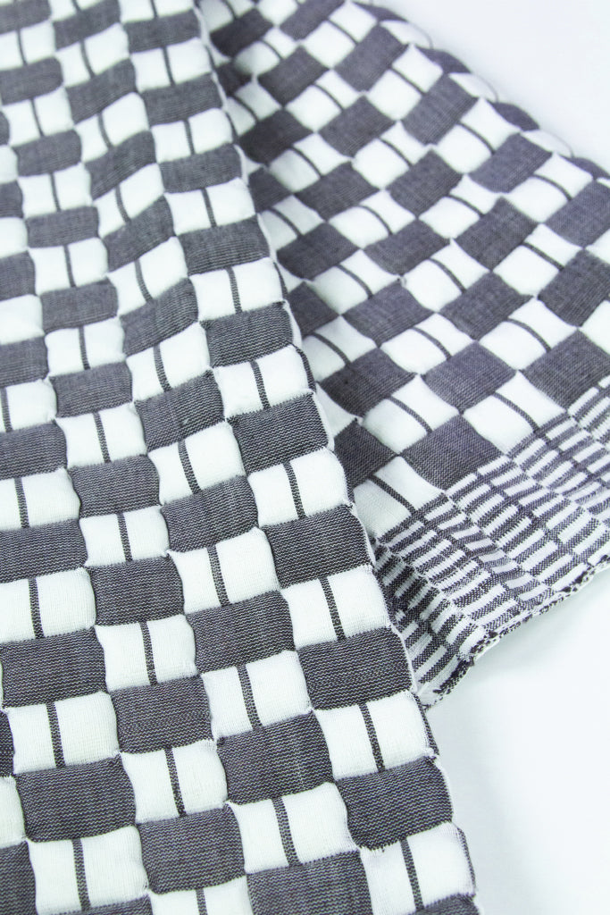 Geocheck Bauhaus Quilted Blanket in Pewter
